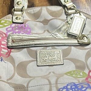 Coach Beige Signature Tote with Metallic Gold Trim and Multicolor Floral Accents